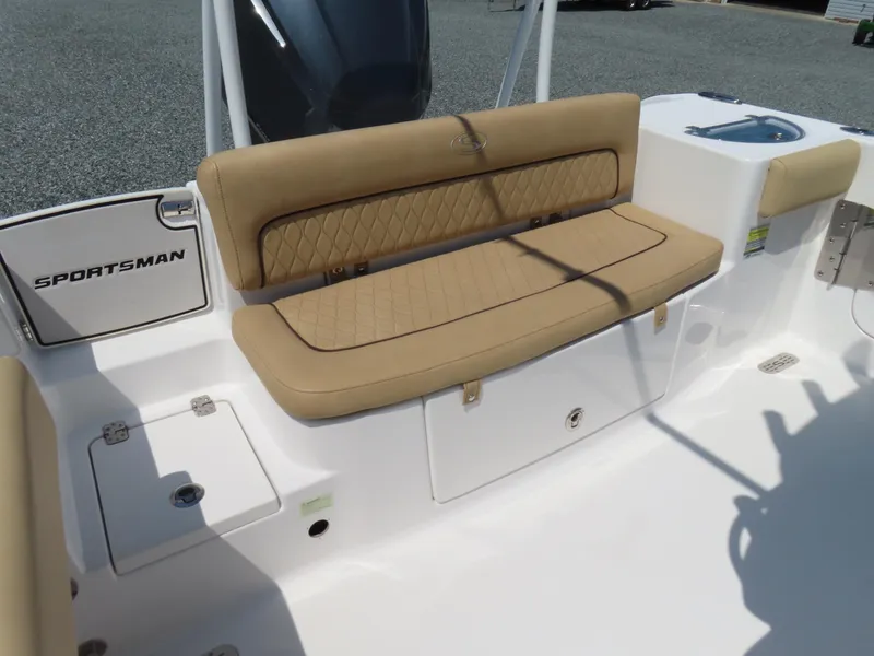 Slide: The Image of 2018 Sportsman Heritage 251 Center Console boat with tan cushioned seating and white deck. - 38