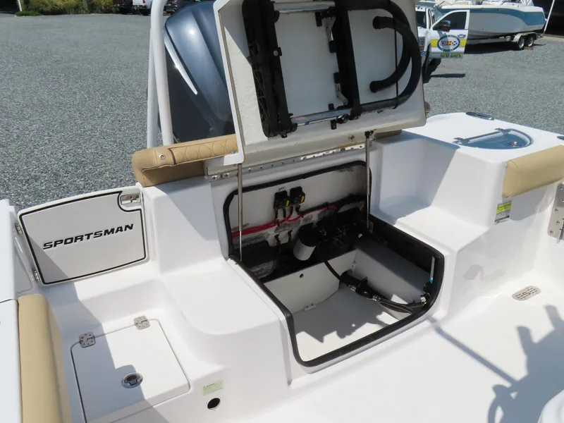 Slide: The Image of 2018 Sportsman Heritage 251 Center Console boat with open storage compartment. - 40