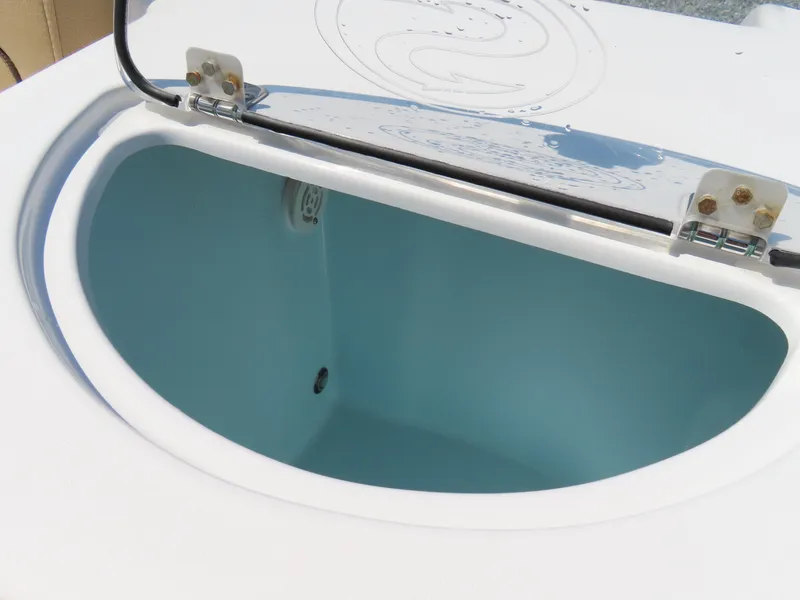 Slide: The Image of Open storage compartment on 2018 Sportsman Heritage 251 Center Console boat. - 43