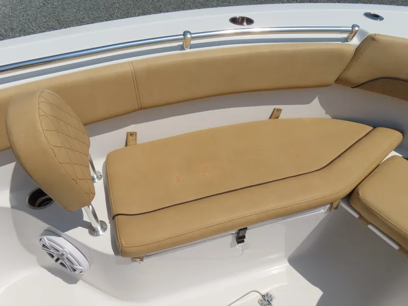 Slide: The Image of 2018 Sportsman Heritage 251 Center Console boat with tan cushioned seating and stainless steel rail. - 9