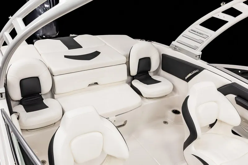 Slide: The Image of 2026 Chaparral 21 SSi Ski & Fish OB interior with white and black seating. - 14