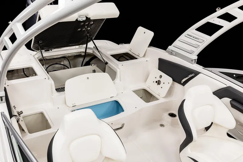 Slide: The Image of 2026 Chaparral 21 SSi Ski & Fish OB interior with seating and storage compartments. - 15