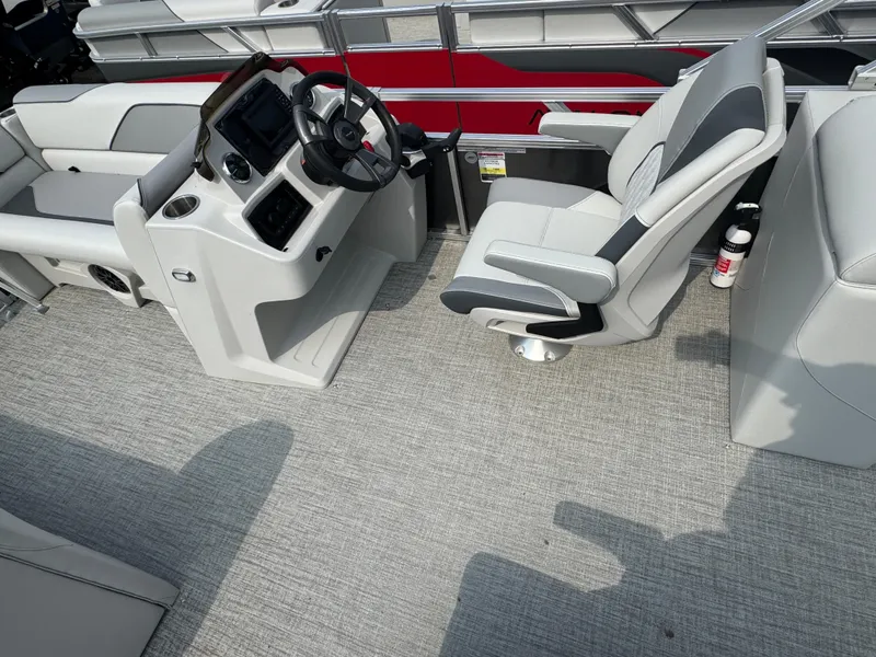 Slide: The Image of 2025 Avalon Venture QL boat interior with modern helm and comfortable seating. - 3