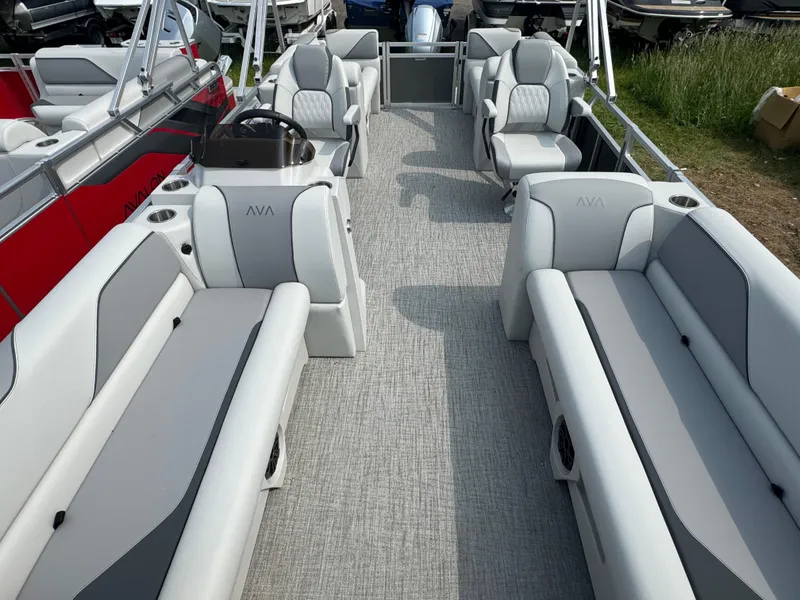Slide: The Image of 2025 Avalon Venture QL pontoon boat interior with gray seating and modern design. - 6
