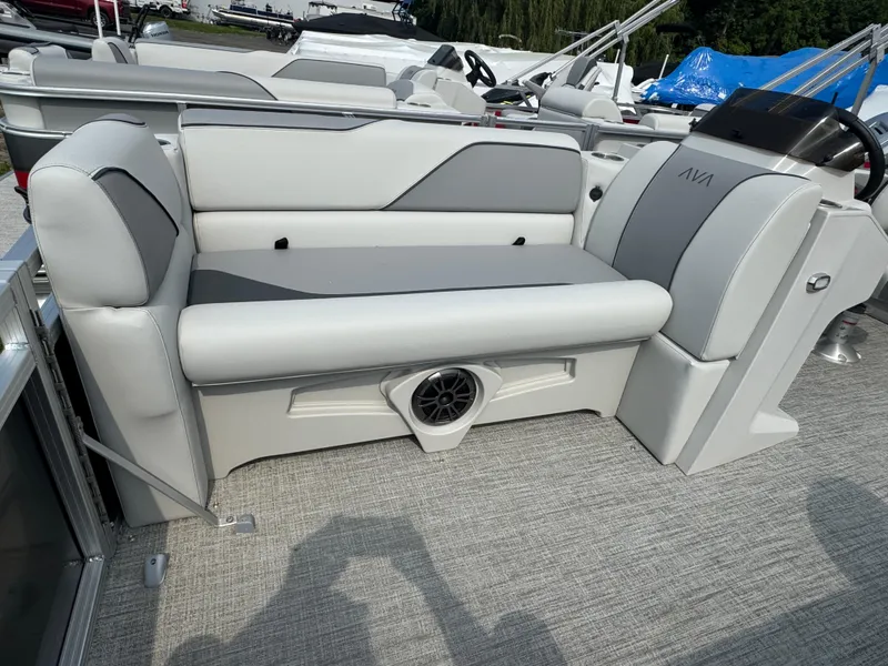 Slide: The Image of 2025 Avalon Venture QL boat interior with gray seating and speaker system. - 7