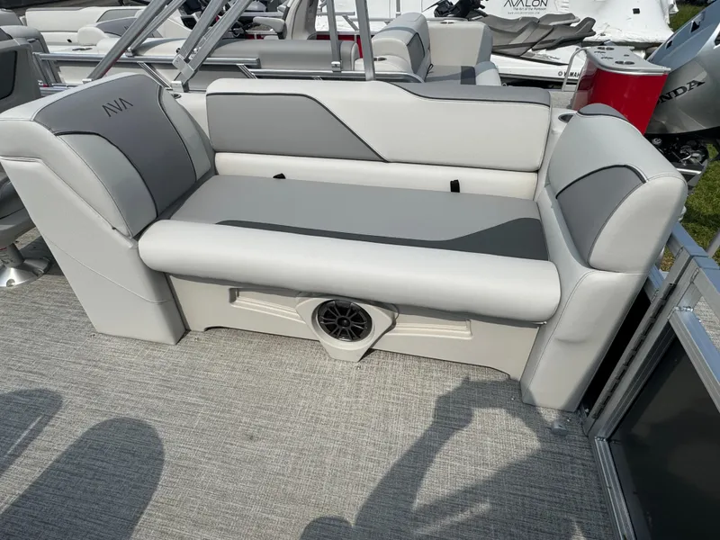 Slide: The Image of 2025 Avalon Venture QL boat interior with gray seating and speaker system. - 9