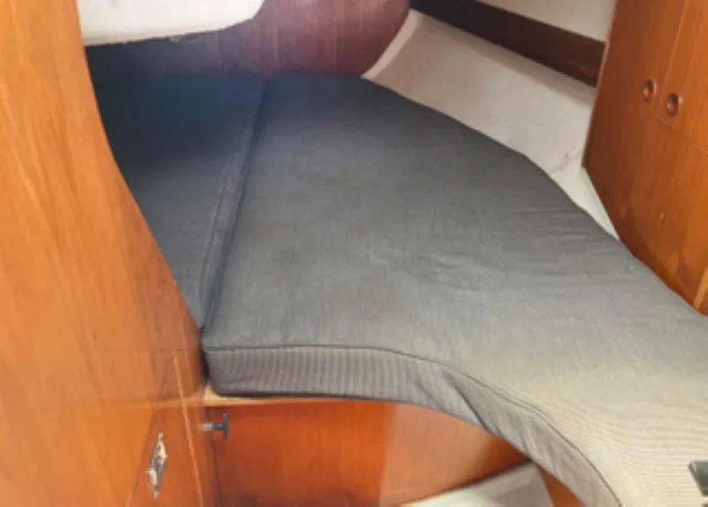 Slide: The Image of Cozy cabin interior of 1991 Beneteau MOORINGS 38 sailboat with wooden finish. - 9
