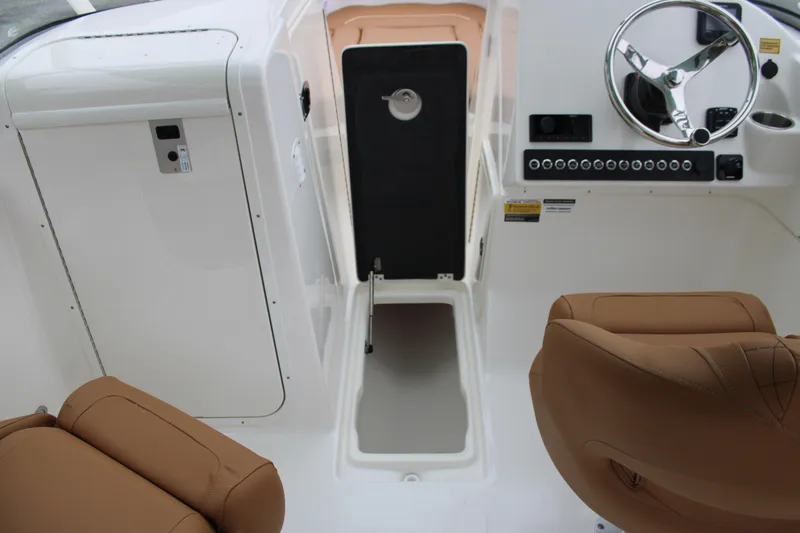 Slide: The Image of Interior view of 2026 Key West 239 DFS boat cockpit with steering wheel and seating. - 20