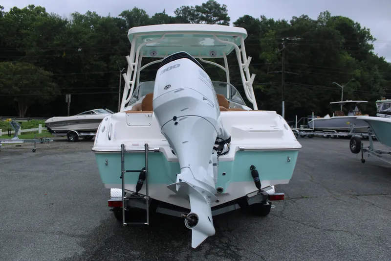 Slide: The Image of 2026 Key West 239 DFS boat with powerful outboard motor, parked on a trailer. - 6