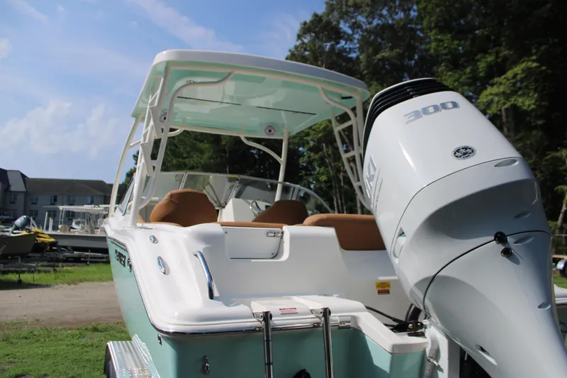 Slide: The Image of 2026 Key West 239 DFS boat with powerful 300 HP engine, docked outdoors. - 8