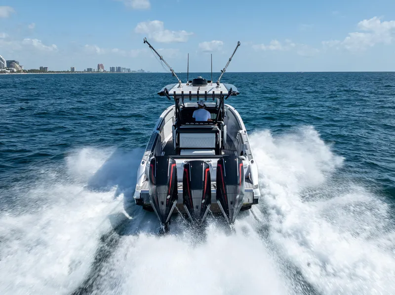 Slide: The Image of 2022 Nor-Tech 390 Sport Center Console speeding on open water. - 16