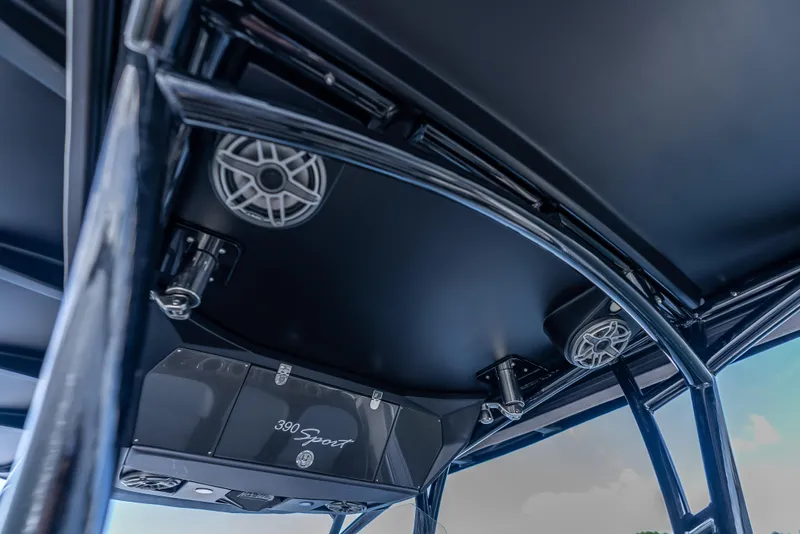 Slide: The Image of 2022 Nor-Tech 390 Sport Center Console boat interior with speakers and sleek design. - 28