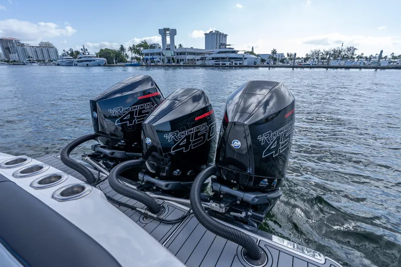 Slide: The Image of 2022 Nor-Tech 390 Sport Center Console with triple Mercury Racing 450R engines on water. - 34