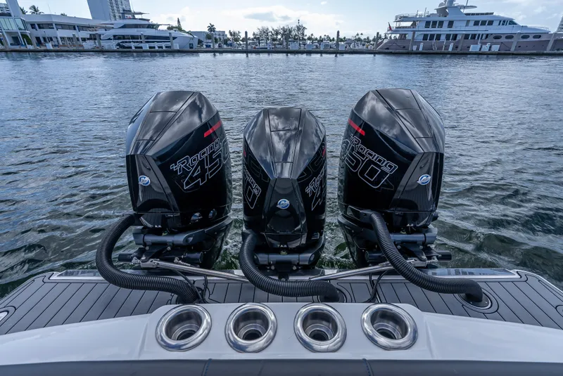 Slide: The Image of Triple Mercury Racing 450 engines on a 2022 Nor-Tech 390 Sport Center Console boat. - 35