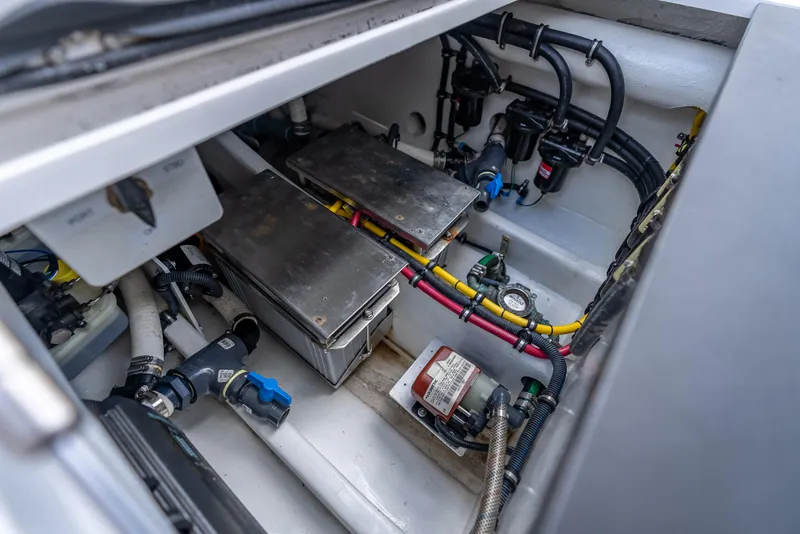 Slide: The Image of Engine compartment of 2022 Nor-Tech 390 Sport Center Console, showcasing wiring and components. - 37