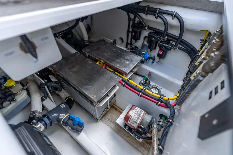 Slide: The Image of Engine compartment of 2022 Nor-Tech 390 Sport Center Console with wiring and components. - 38