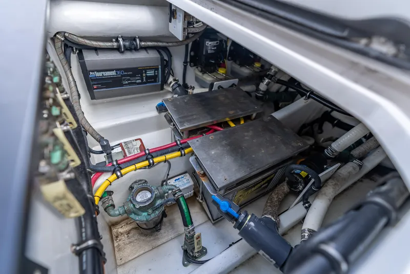 Slide: The Image of Engine compartment of 2022 Nor-Tech 390 Sport Center Console with wiring and components. - 39