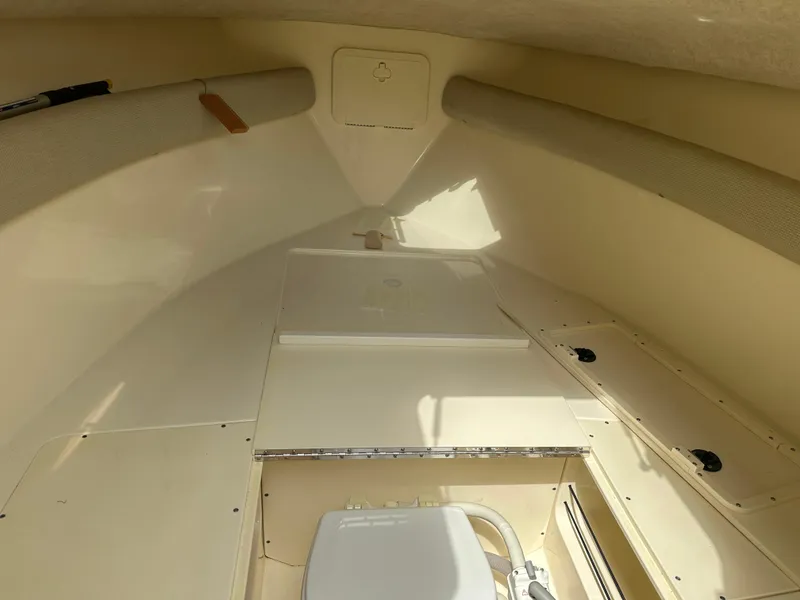 Slide: The Image of Interior cabin of 2008 Scout 222 Abaco boat, featuring storage compartments and seating. - 12
