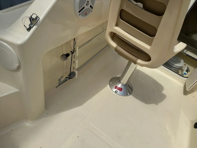 Slide: The Image of Interior of 2008 Scout 222 Abaco boat showing seating and speaker system. - 16