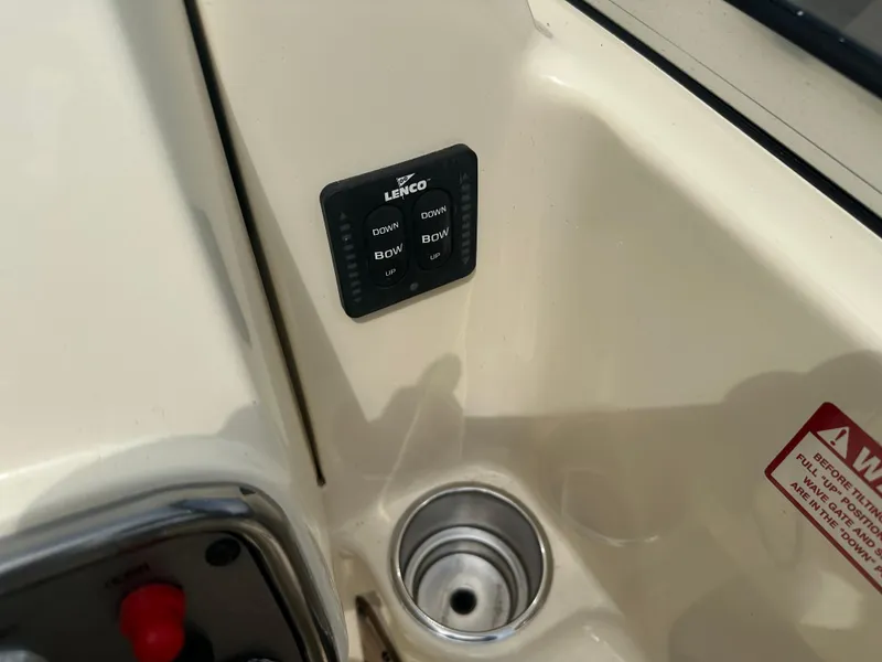 Slide: The Image of Control panel on 2008 Scout 222 Abaco boat, featuring Lenco trim tab switches. - 19