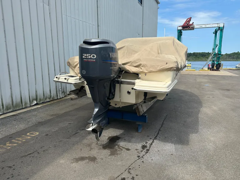 Slide: The Image of 2008 Scout 222 Abaco boat with Yamaha 250 outboard motor, docked and covered. - 20