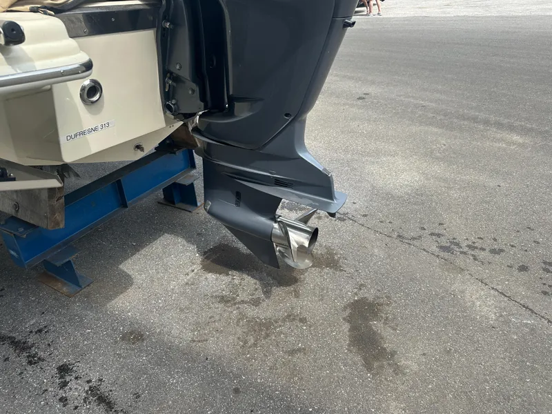 Slide: The Image of Outboard motor of a 2008 Scout 222 Abaco boat on a stand. - 23