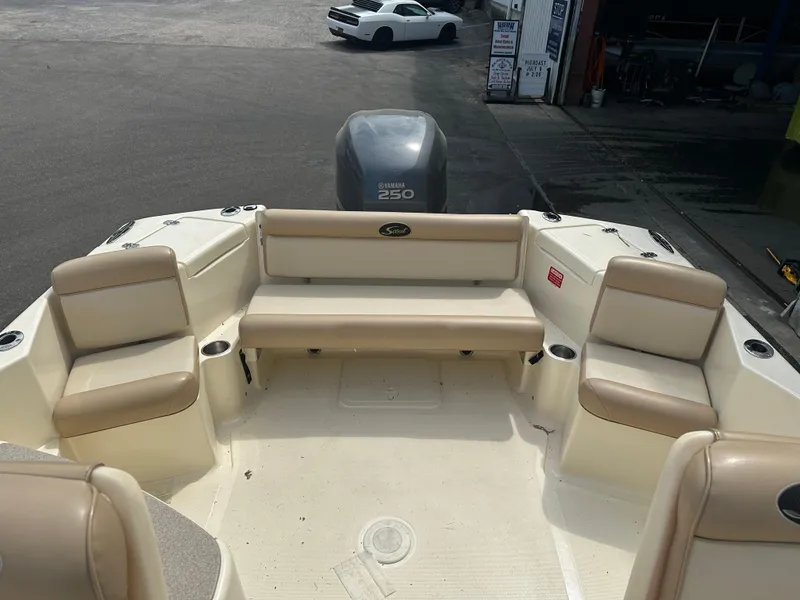 Slide: The Image of 2008 Scout 222 Abaco boat interior with beige seating and Yamaha 250 engine. - 3