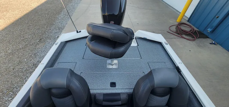 Slide: The Image of 2019 Tracker Pro Team 190 TX Tournament Edition boat with seating and storage compartments. - 12