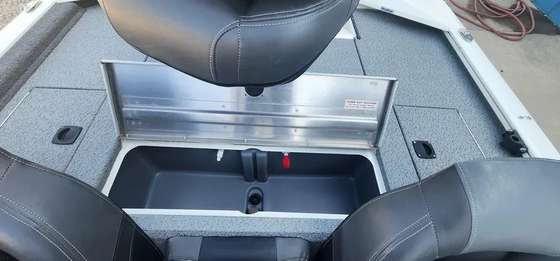 Slide: The Image of 2019 Tracker Pro Team 190 TX Tournament Edition boat interior with storage compartment. - 13