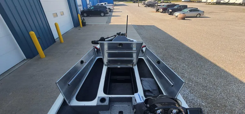 Slide: The Image of 2019 Tracker Pro Team 190 TX Tournament Edition boat with open storage compartments. - 8