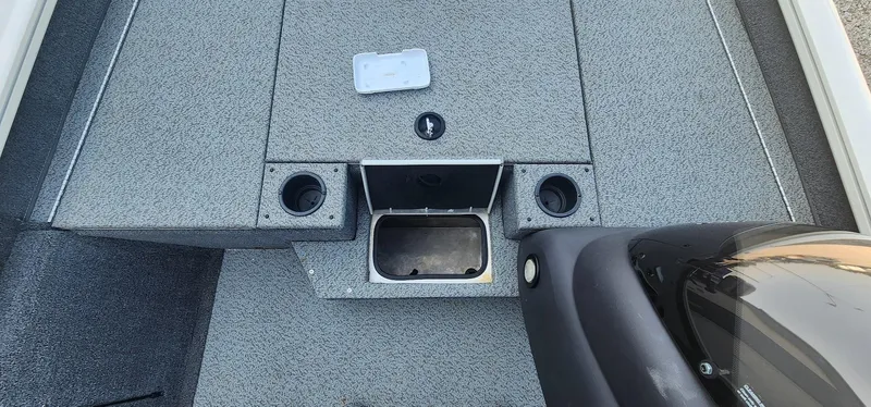 Slide: The Image of 2019 Tracker Pro Team 190 TX Tournament Edition boat interior with storage compartments and cup holders. - 9