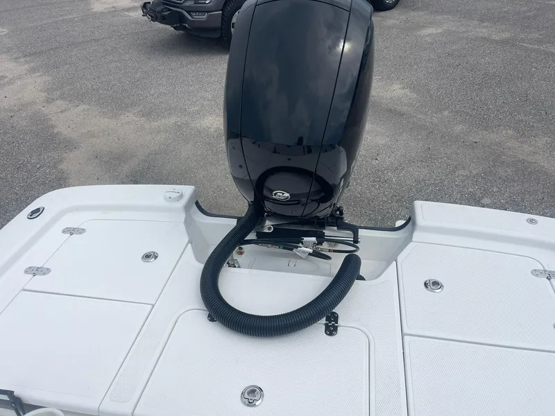 Slide: The Image of 2023 Frontier 2104 boat with outboard motor on a trailer. - 12