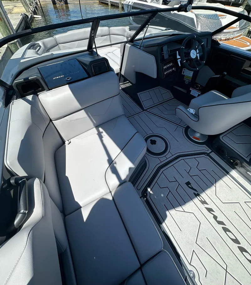 Slide: The Image of 2024 Moomba Kaiyen boat interior with sleek seating and modern dashboard design. - 7