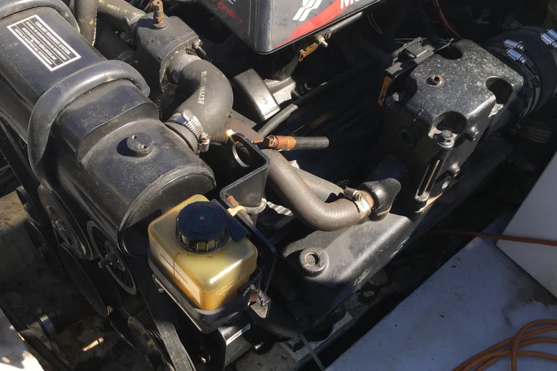 Slide: The Image of 1976 Sport-Craft 25 engine compartment with visible components and hoses. - 16