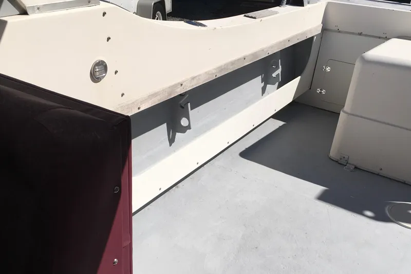 Slide: The Image of Interior view of a 1976 Sport-Craft 25 boat, showcasing seating and storage areas. - 18