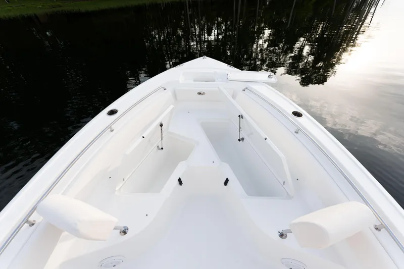 Slide: The Image of 2024 Sea Hunt Ultra 239 SE boat bow with seating and storage compartments. - 10