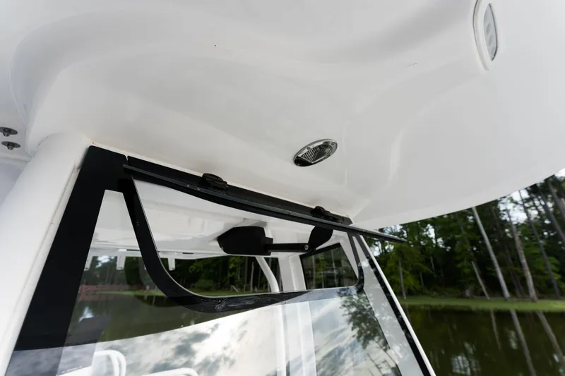 Slide: The Image of 2024 Sea Hunt Ultra 239 SE boat windshield and canopy detail. - 21