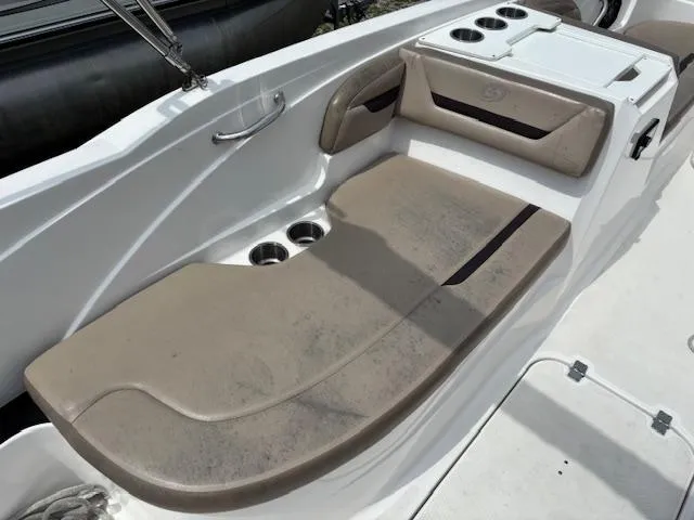 Slide: The Image of 2022 Hurricane SS 205 OB boat seating area with cup holders and storage. - 11