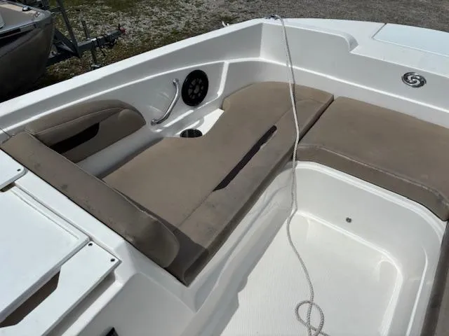Slide: The Image of 2022 Hurricane SS 205 OB boat interior with beige seating and speaker system. - 14