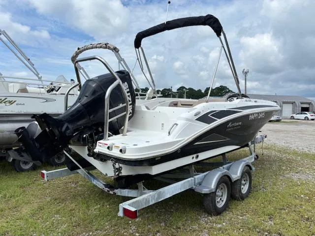 Slide: The Image of 2022 Hurricane SS 205 OB boat on trailer, parked outdoors under cloudy sky. - 4