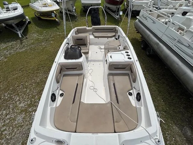 Slide: The Image of 2022 Hurricane SS 205 OB boat with spacious seating and modern design, displayed outdoors. - 8