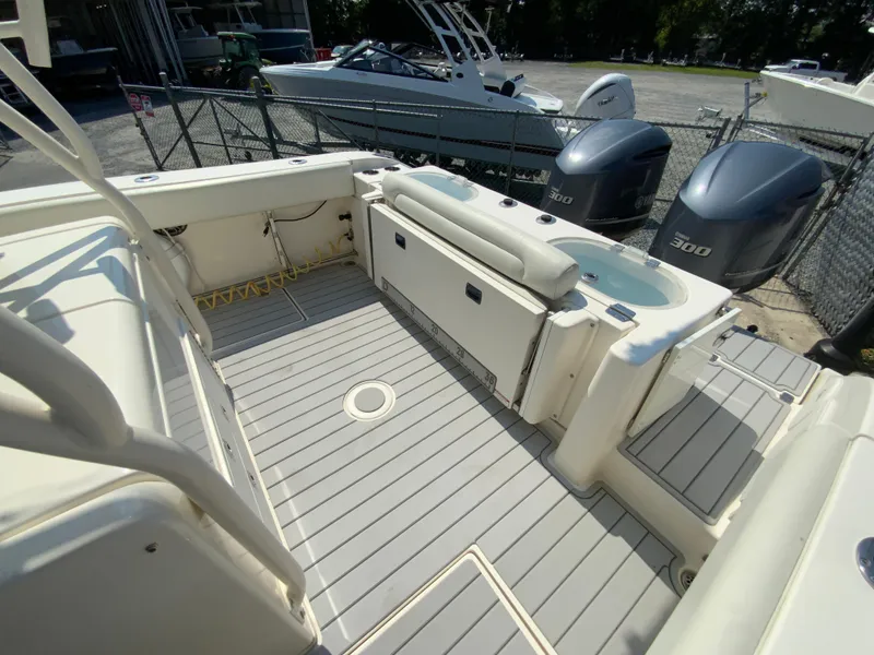 Slide: The Image of 2013 Cobia 296 Center Console boat interior with twin Yamaha 300 engines. - 15