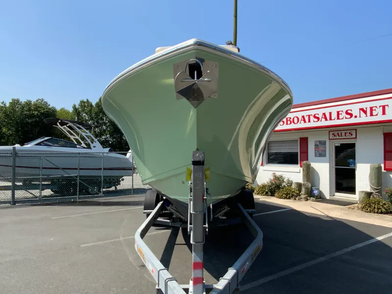 Slide: The Image of 2013 Cobia 296 Center Console boat on trailer at sales lot. - 4