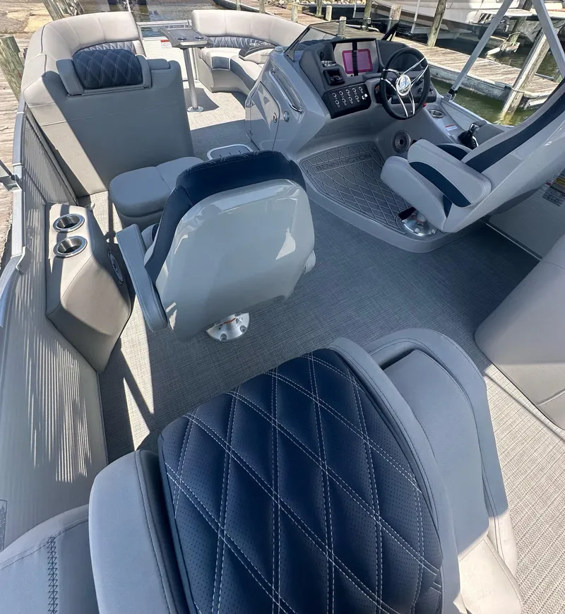 Slide: The Image of Interior of 2025 Bennington 23 RSR boat with luxurious seating and modern dashboard. - 8