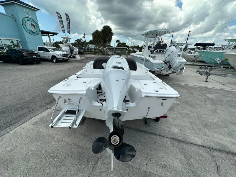 Slide: The Image of 2026 Sea Pro 172 Bay boat displayed at Palm City Yachts dealership. - 4