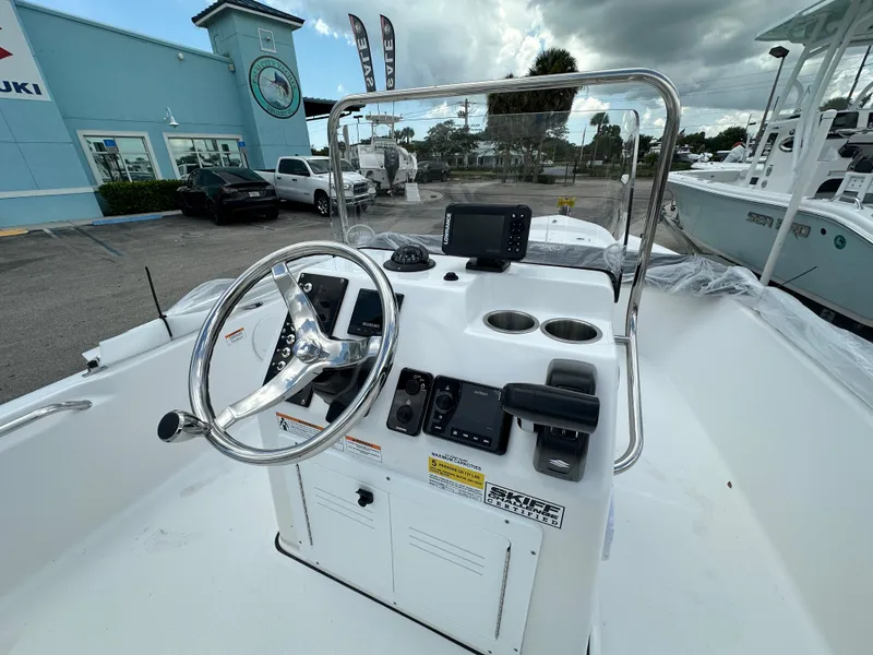 Slide: The Image of 2026 Sea Pro 172 Bay boat console with steering wheel and controls. - 5