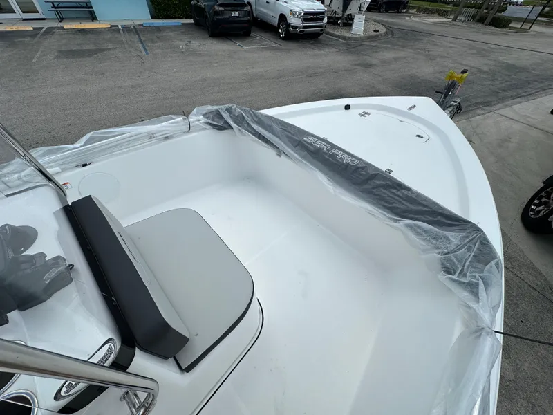 Slide: The Image of 2026 Sea Pro 172 Bay boat at Suzuki Marine dealership, showcasing sleek design and seating. - 6