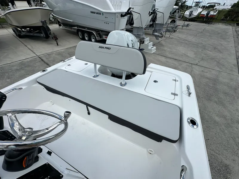 Slide: The Image of 2026 Sea Pro 172 Bay boat storage compartment, open and empty. - 9