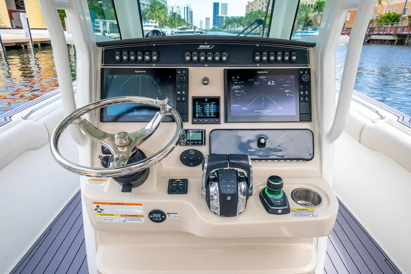 Slide: The Image of 2018 Boston Whaler 280 Outrage helm with advanced navigation and control systems. - 17