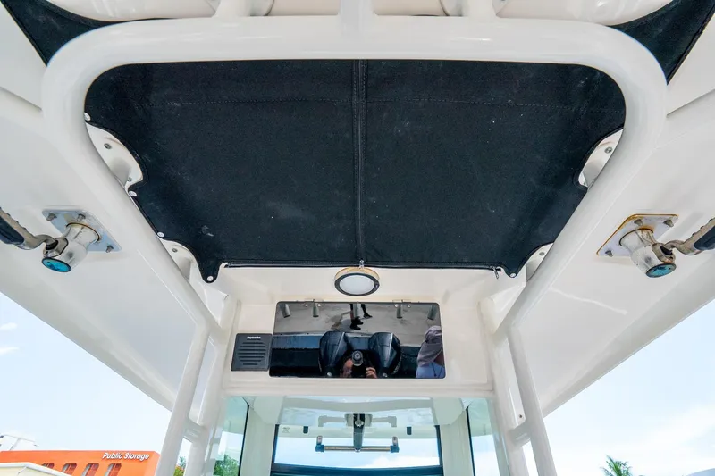 Slide: The Image of 2018 Boston Whaler 280 Outrage boat interior, featuring a sleek overhead design and modern fixtures. - 19